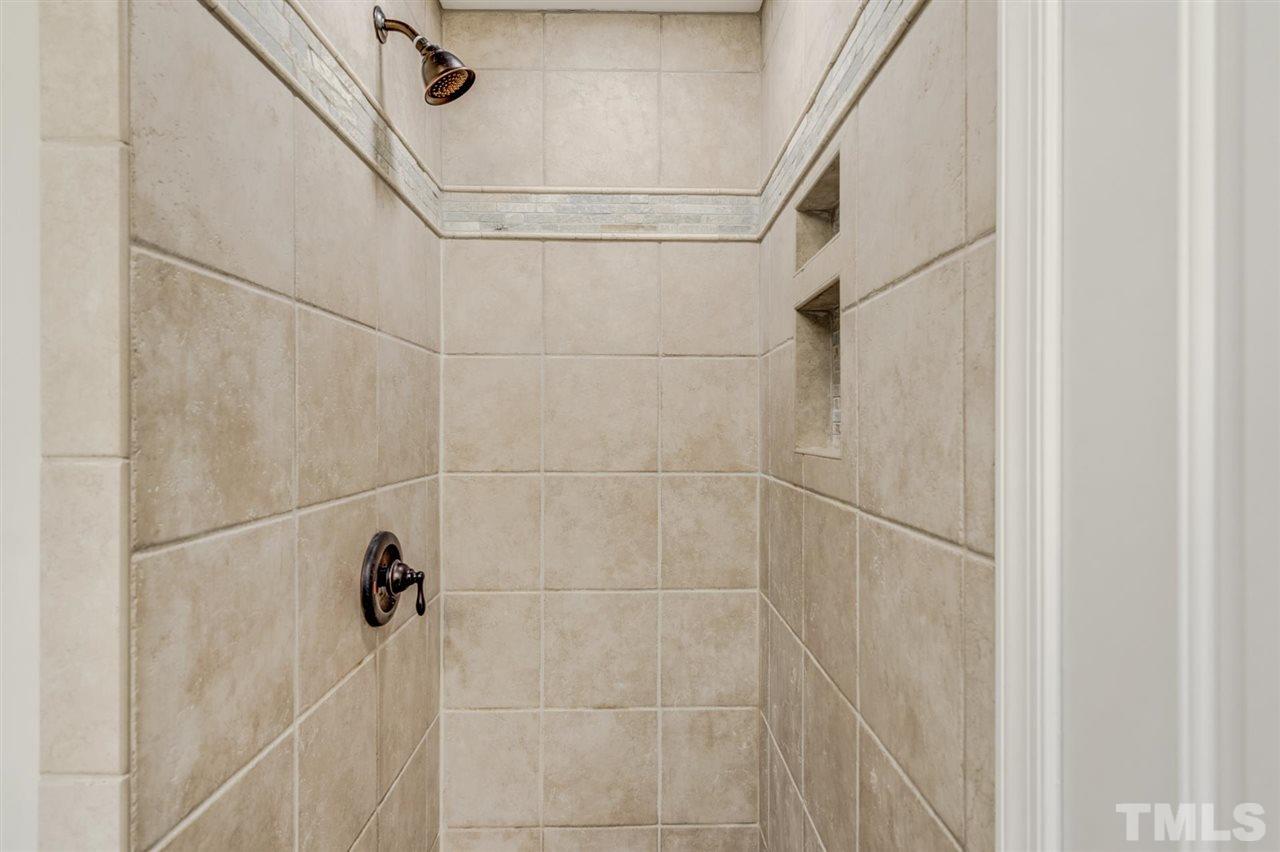 5907 Newhall Road Durham, NC 27713 - Photo 16 of 29 a bathroom with a shower