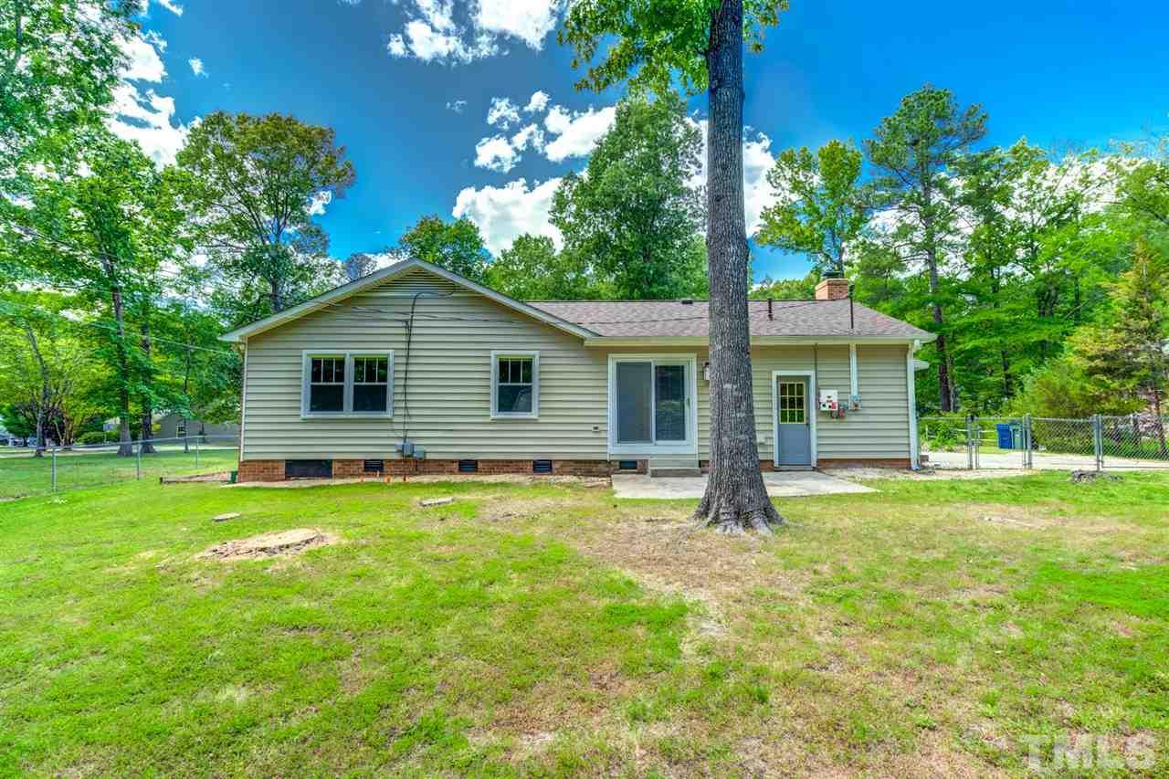 5907 Newhall Road Durham, NC 27713 - Photo 22 of 29 a house view with a garden space