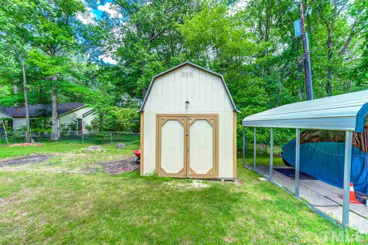 5907 Newhall Road Durham, NC 27713 - Photo 24 of 29 a view of a house with backyard