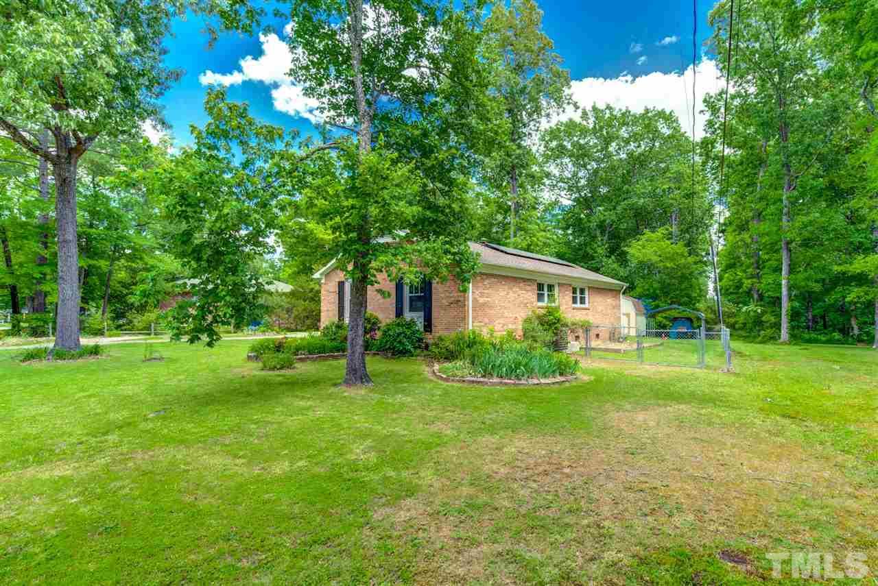 5907 Newhall Road Durham, NC 27713 - Photo 26 of 29 a view of a house with yard and tree s