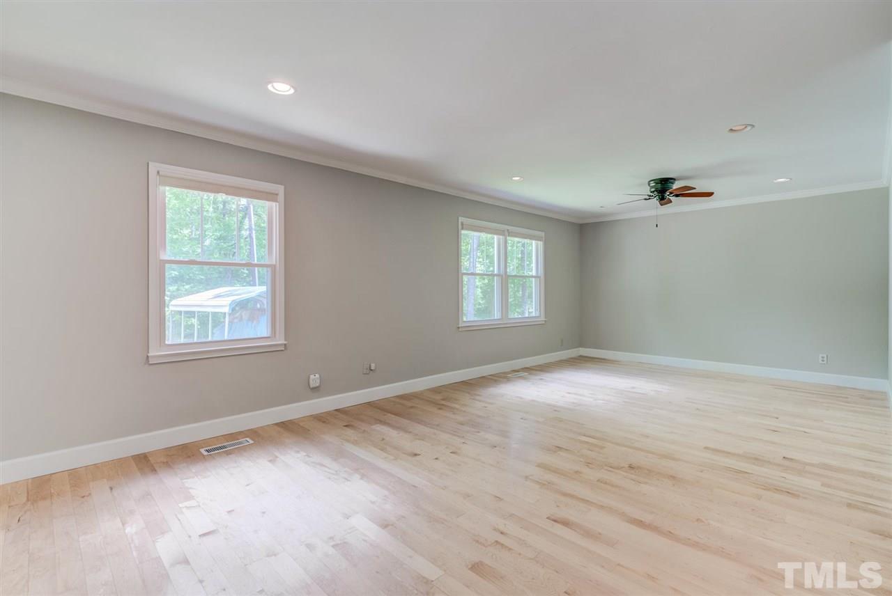 5907 Newhall Road Durham, NC 27713 - Photo 6 of 29 a view of an empty room with a window