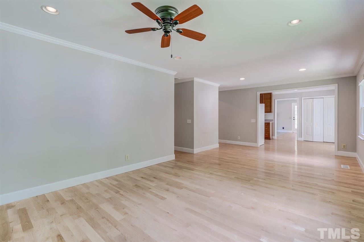 5907 Newhall Road Durham, NC 27713 - Photo 7 of 29 an empty room with closet and a ceiling fan
