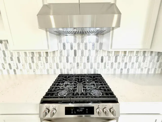 a close view of a stove a washer and dryer