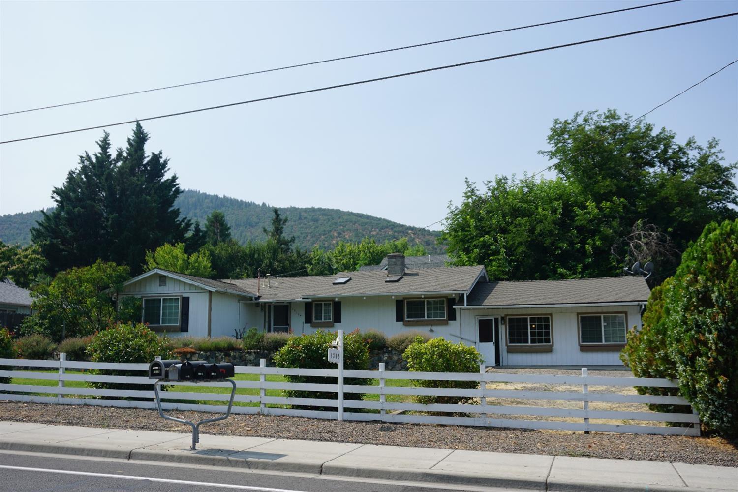 1312 Talent Avenue Talent, OR 97540 - Photo 1 of 21 a front view of a house with a garden