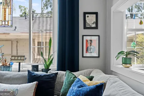 a bedroom with a bed and glass window