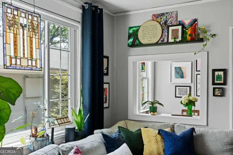 a kitchen with refrigerator and window