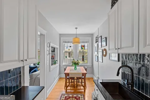 a view of a dining room with furniture wooden floor and windows