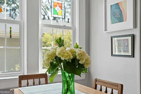 a view of a dining room with furniture window and wooden floor