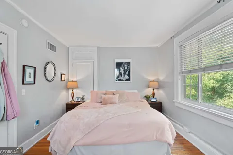 a bed room with a bed and a lamp