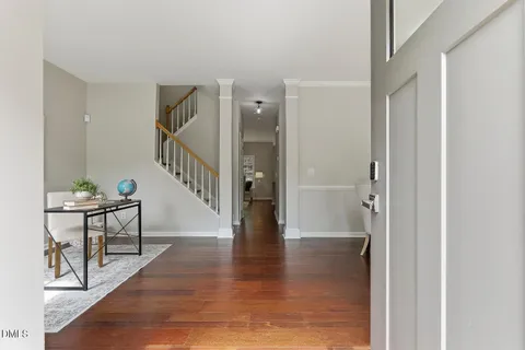a view of an entryway with wooden floor