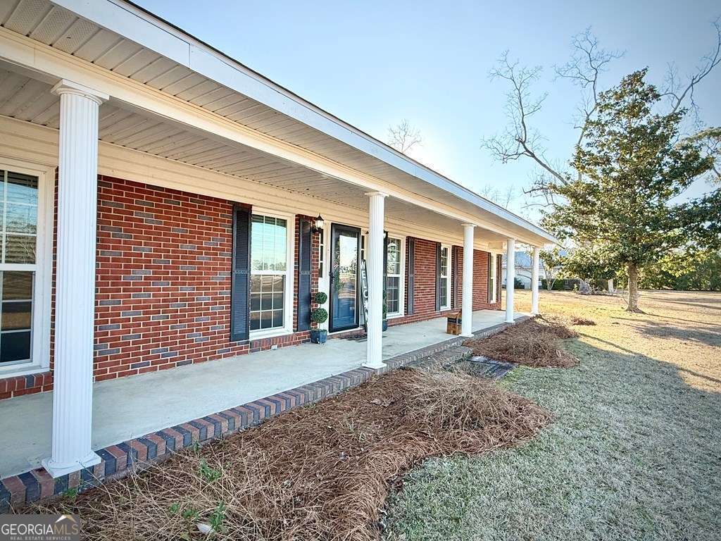 201 Burketts Ferry Road Hazlehurst, GA 31539 - Photo 11 of 52 a view of a house with backyard and garden