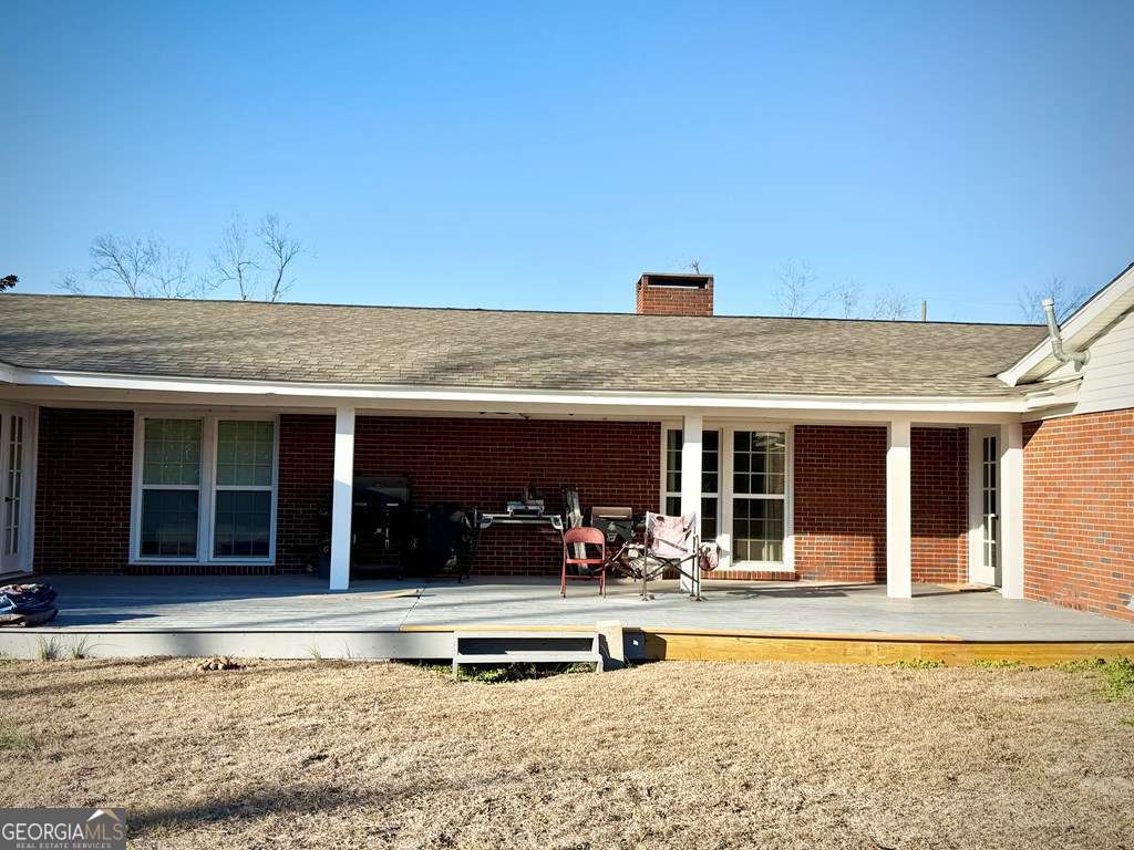 201 Burketts Ferry Road Hazlehurst, GA 31539 - Photo 3 of 52 front view of a building with a patio