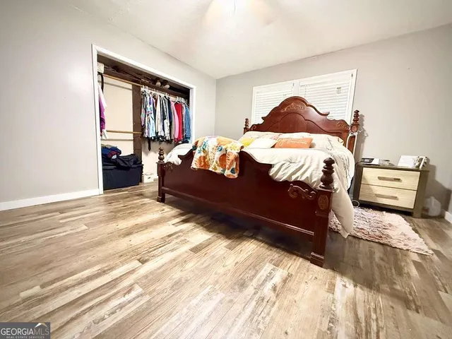 a living room with a couch and a rug