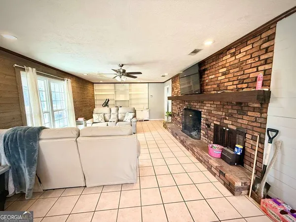 a kitchen with granite countertop white cabinets and sink
