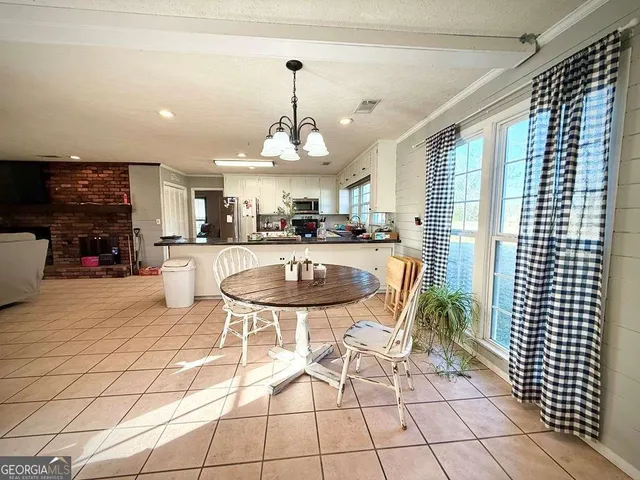 a white toilet sitting next to a small sink