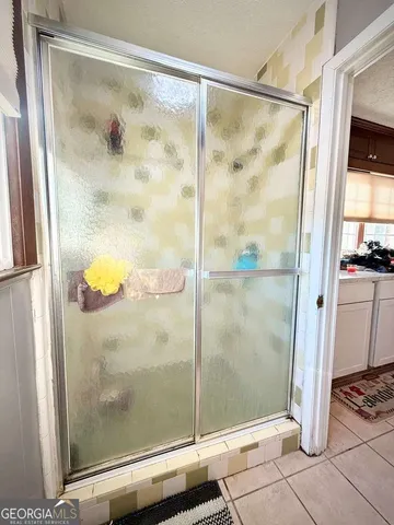 a kitchen with a sink appliances and cabinets