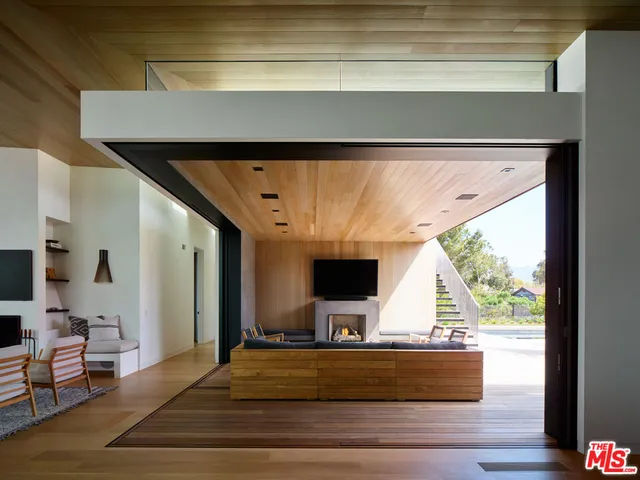 a view of a chairs and table on the wooden floor