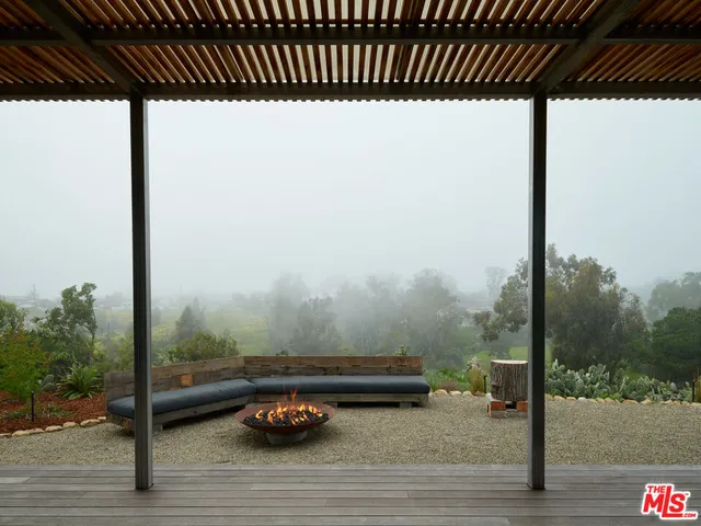 a bathroom with a stove and a mirror