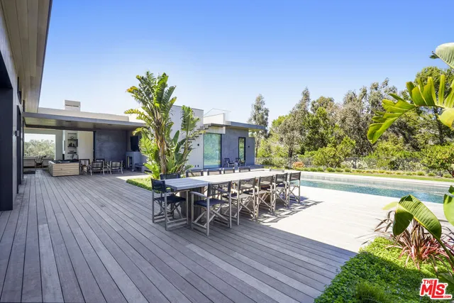 a bedroom with furniture and a flat screen tv