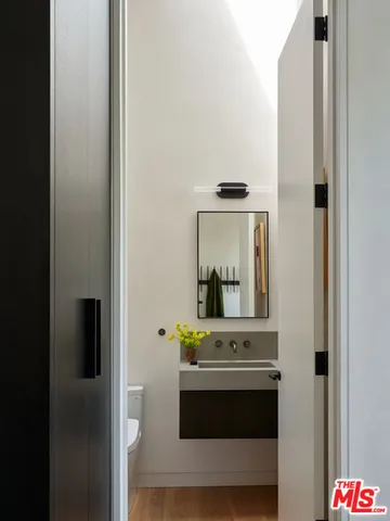 a kitchen with stainless steel appliances a refrigerator and a table