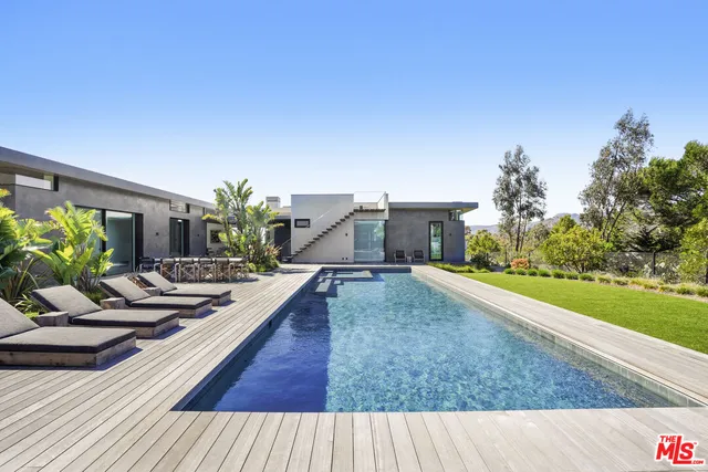 a kitchen with stainless steel appliances a stove a sink dishwasher and a refrigerator