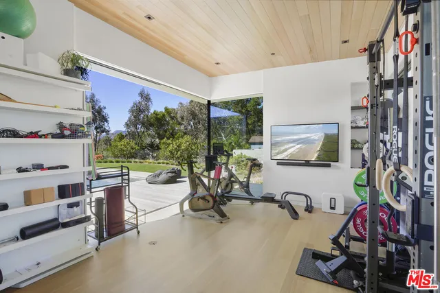 a kitchen with a stove a sink and cabinets