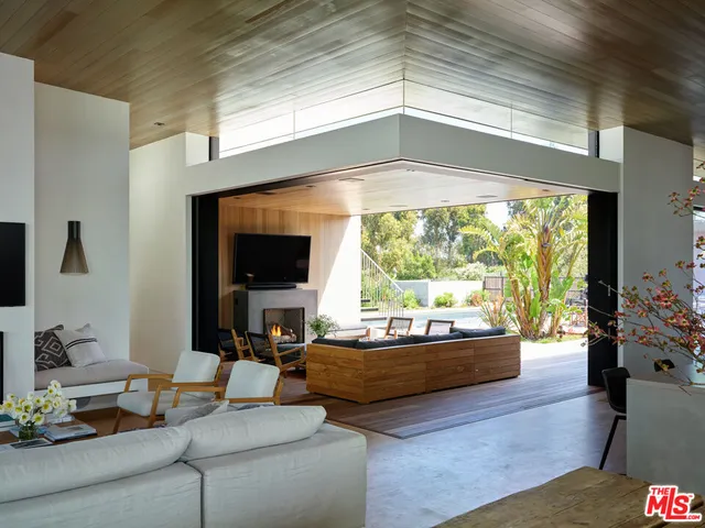 a view of a balcony with yard