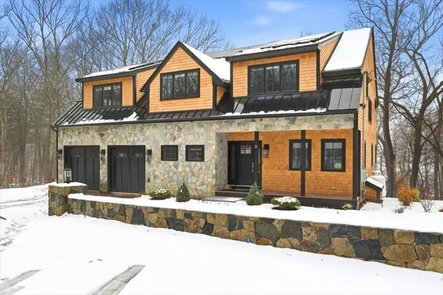 a large kitchen with stainless steel appliances granite countertop a sink and a stove