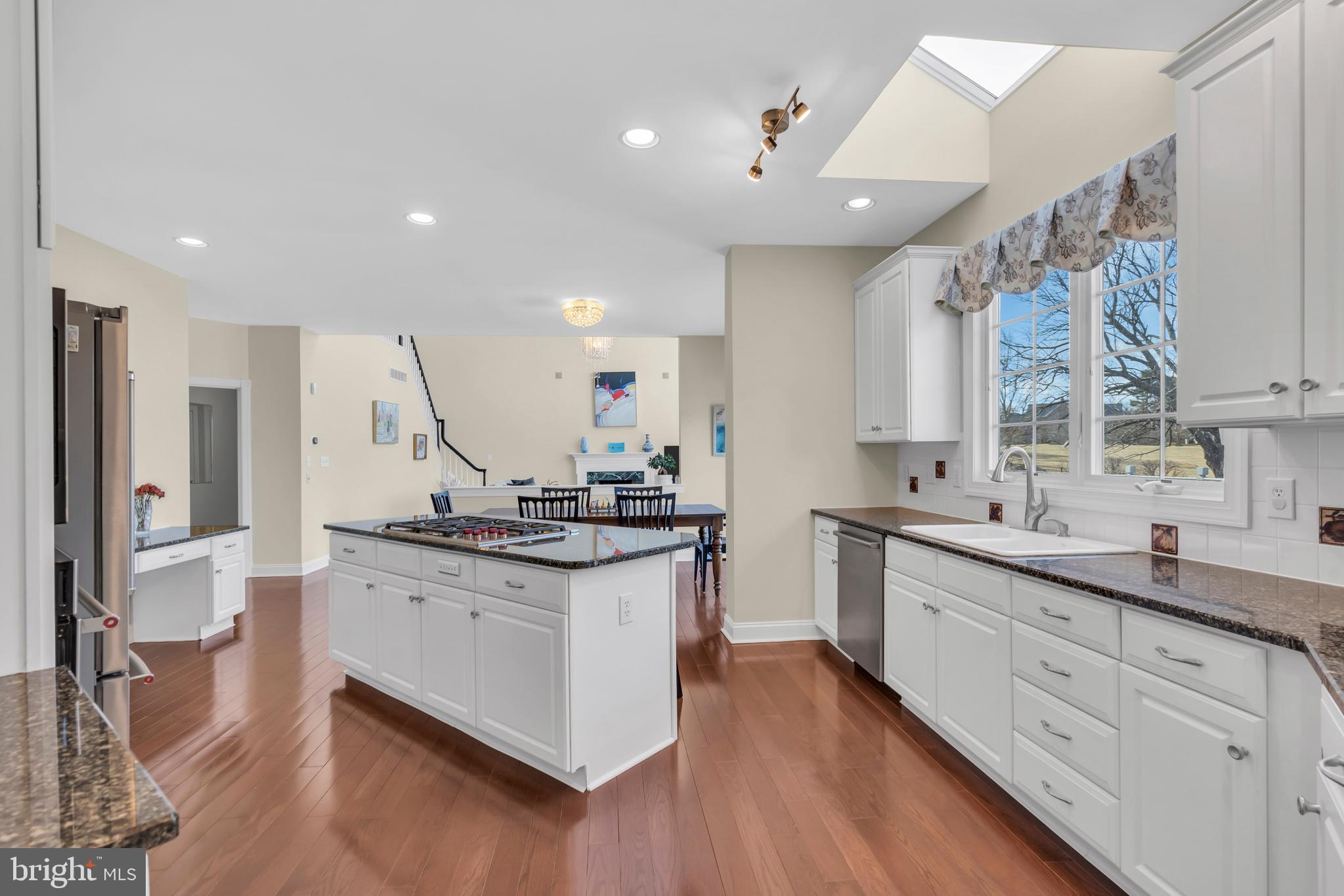 317 Christopher Drive Princeton, NJ 08540 - Photo 18 of 66 a kitchen with stainless steel appliances granite countertop a sink stove and refrigerator