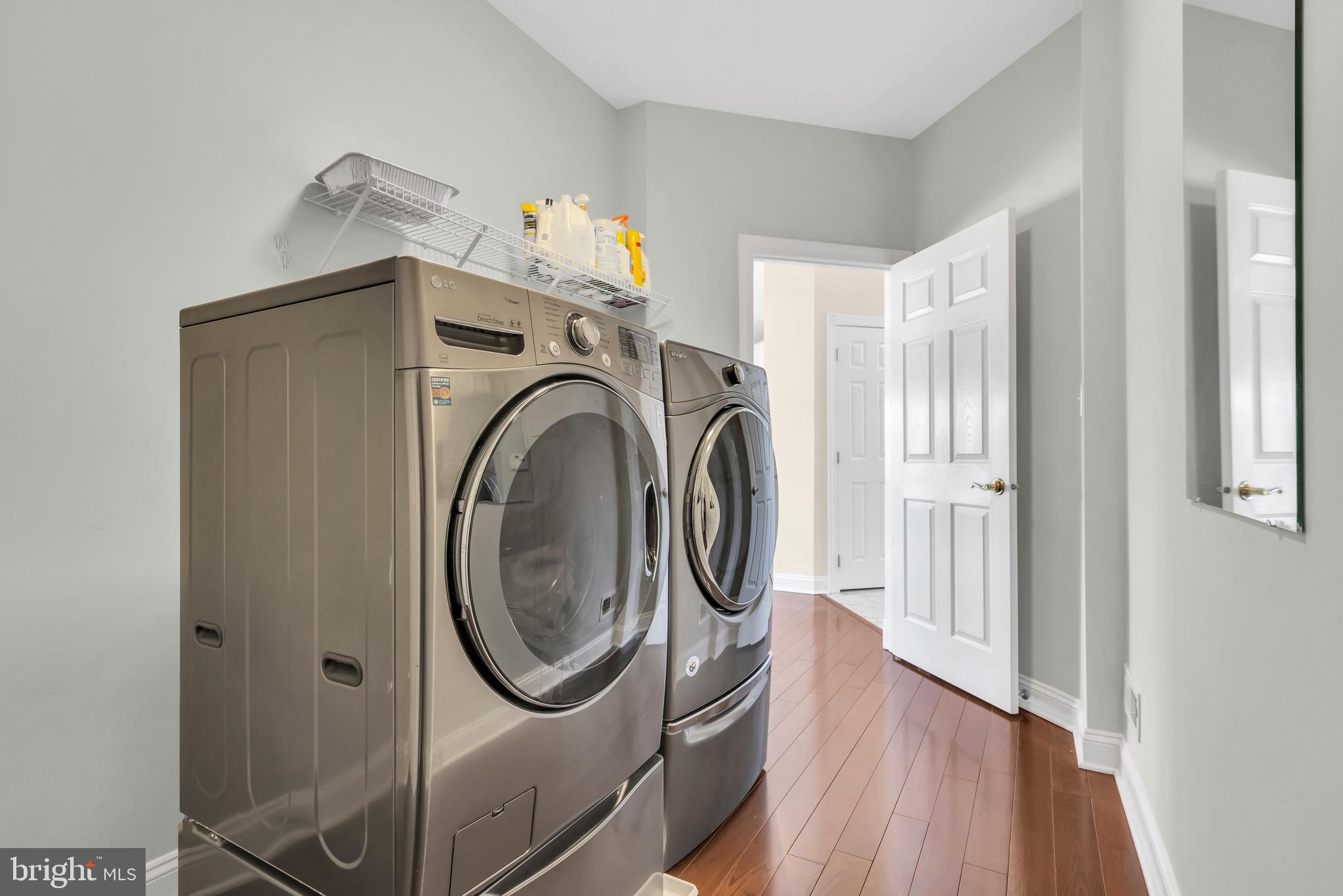 317 Christopher Drive Princeton, NJ 08540 - Photo 30 of 66 a utility room with wooden floor washer and dryer