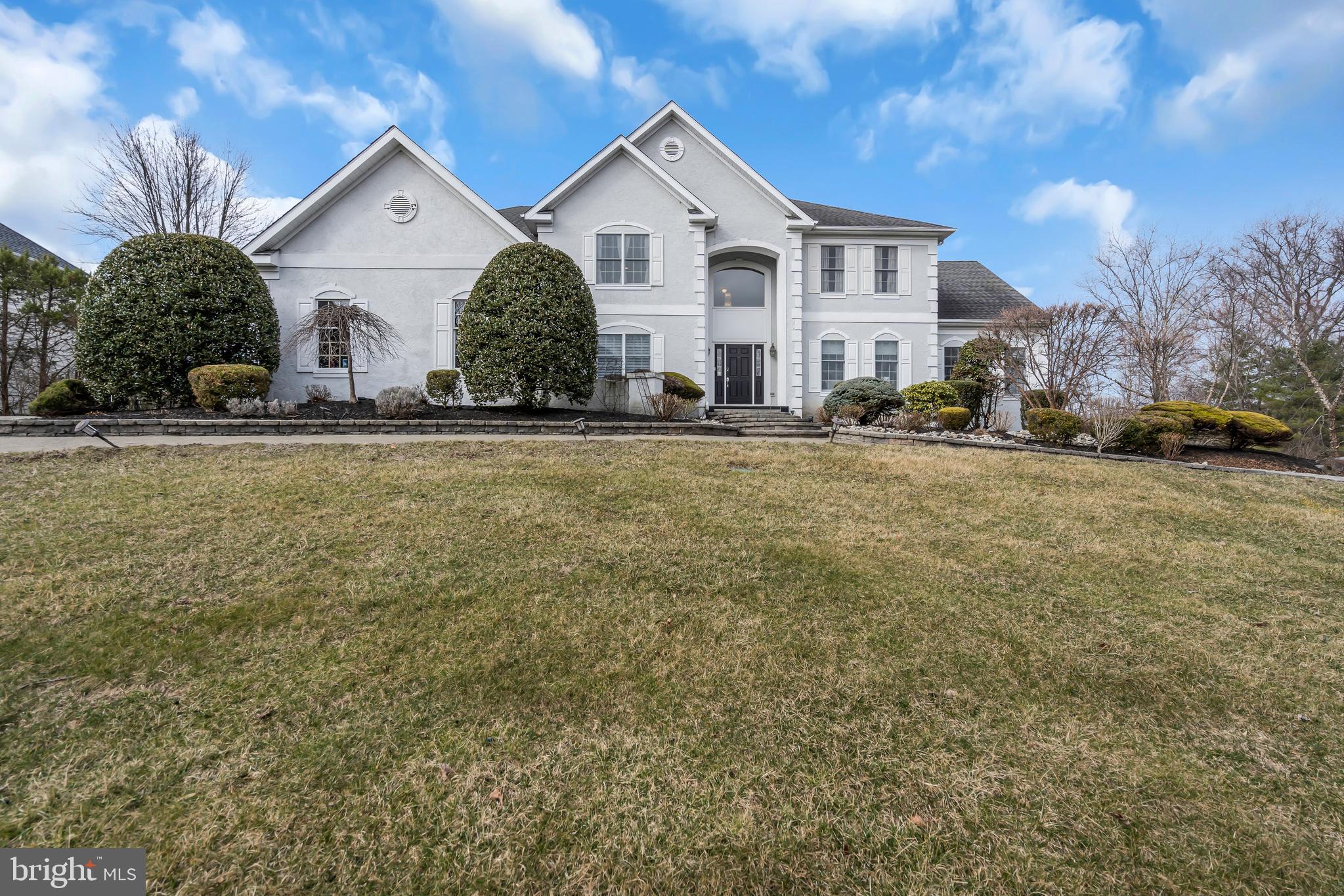317 Christopher Drive Princeton, NJ 08540 - Photo 3 of 66 a view of a house with a yard and large trees