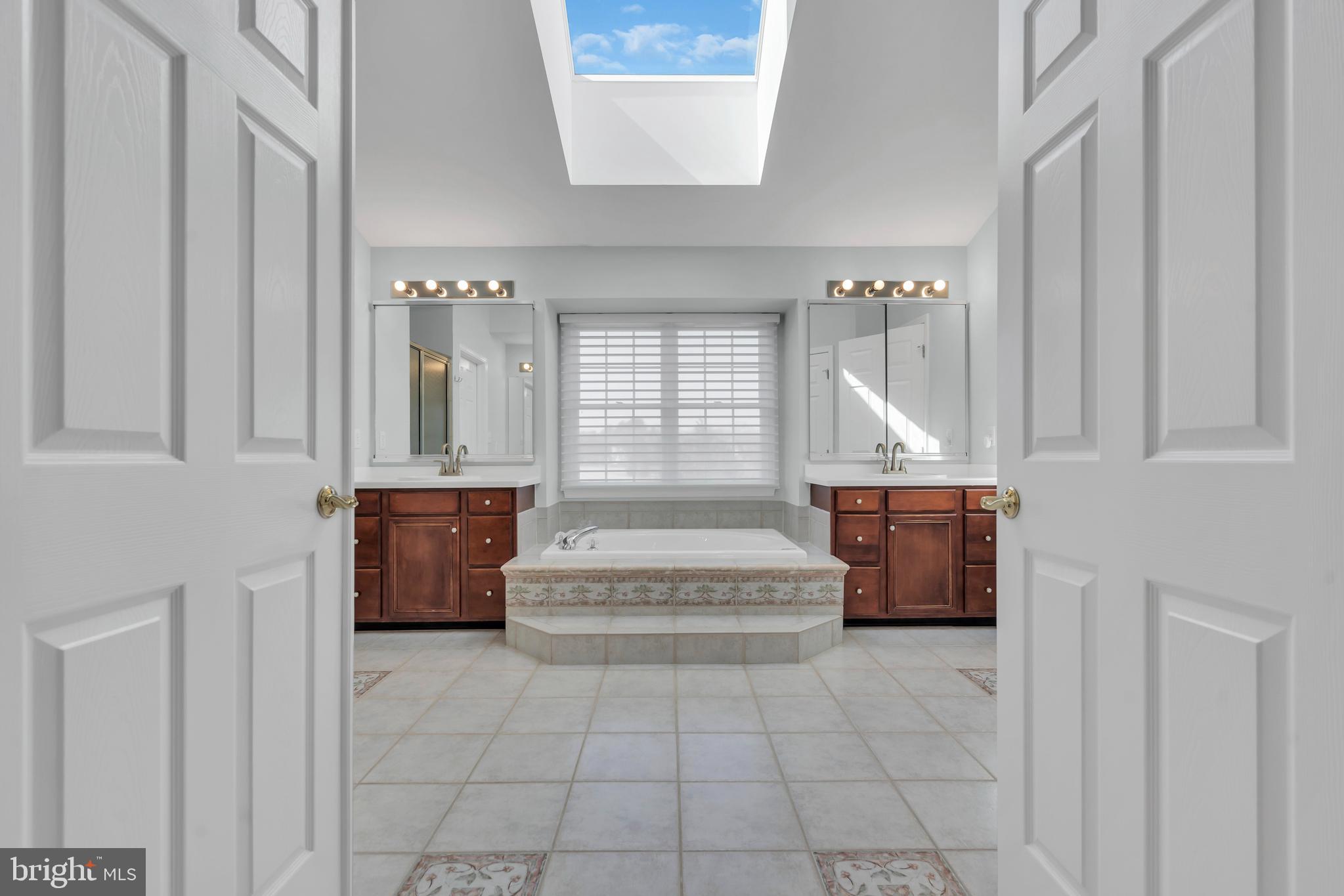 317 Christopher Drive Princeton, NJ 08540 - Photo 38 of 66 a bathroom with a tub sink and mirror