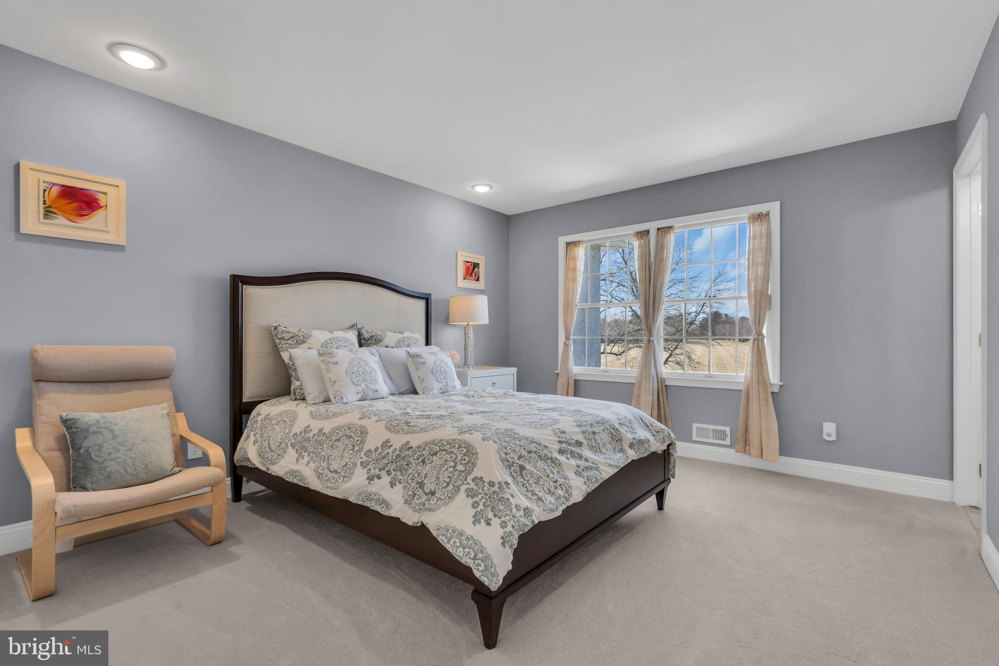 317 Christopher Drive Princeton, NJ 08540 - Photo 40 of 66 a bedroom with a bed and large window