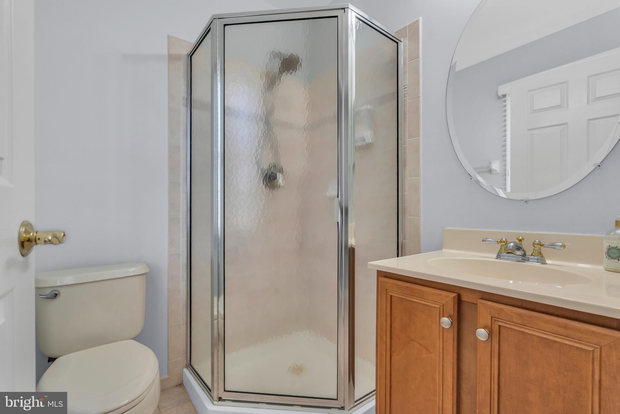 317 Christopher Drive Princeton, NJ 08540 - Photo 41 of 66 a bathroom with a granite countertop sink toilet and shower