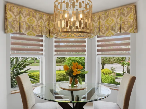 a bathroom with a toilet a sink and a mirror