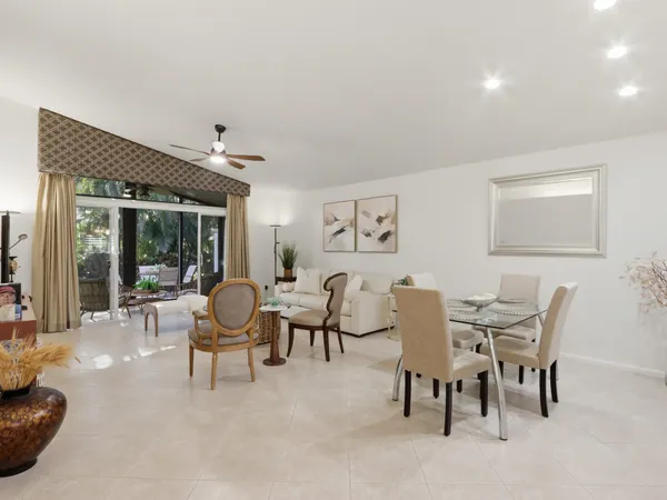 a view of a dining room with furniture and window