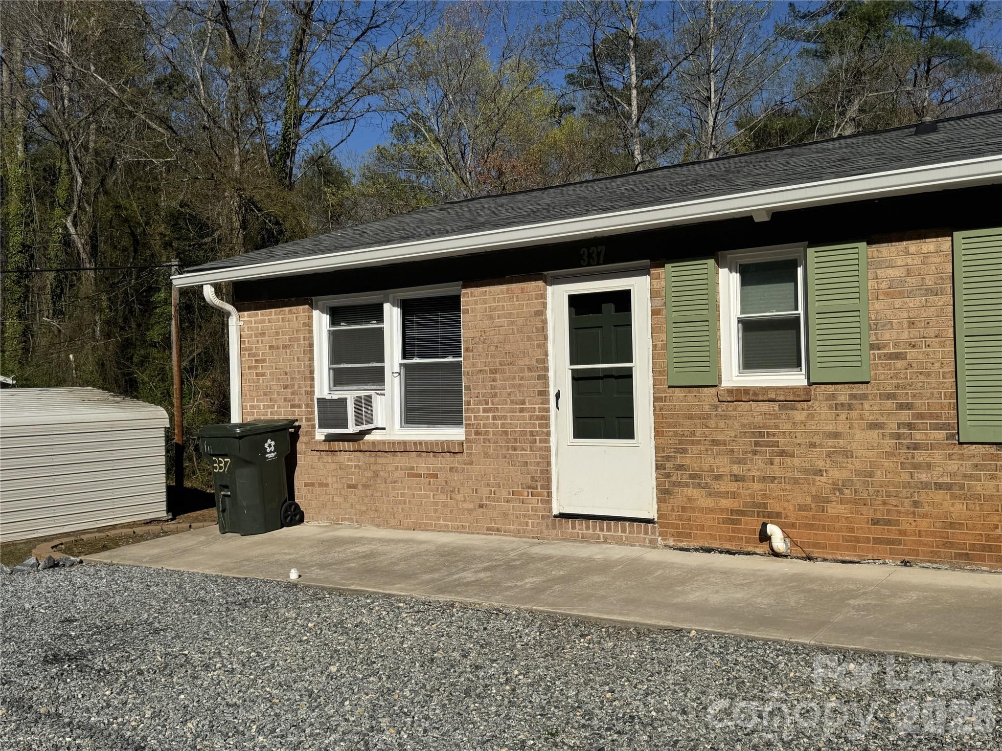 337 Laurel Street Hudson, NC 28638 - Photo 1 of 7 a front view of a house with a yard