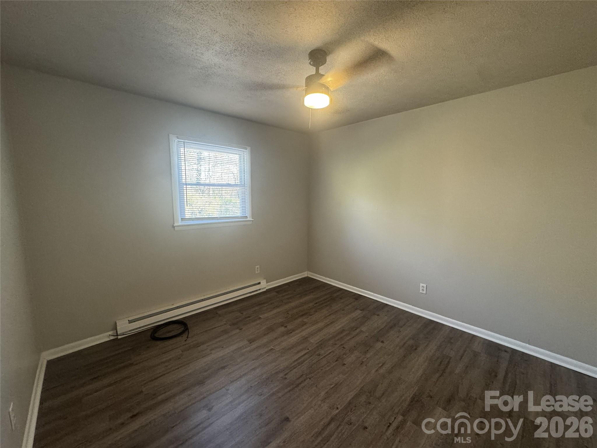 337 Laurel Street Hudson, NC 28638 - Photo 6 of 7 an empty room with a window