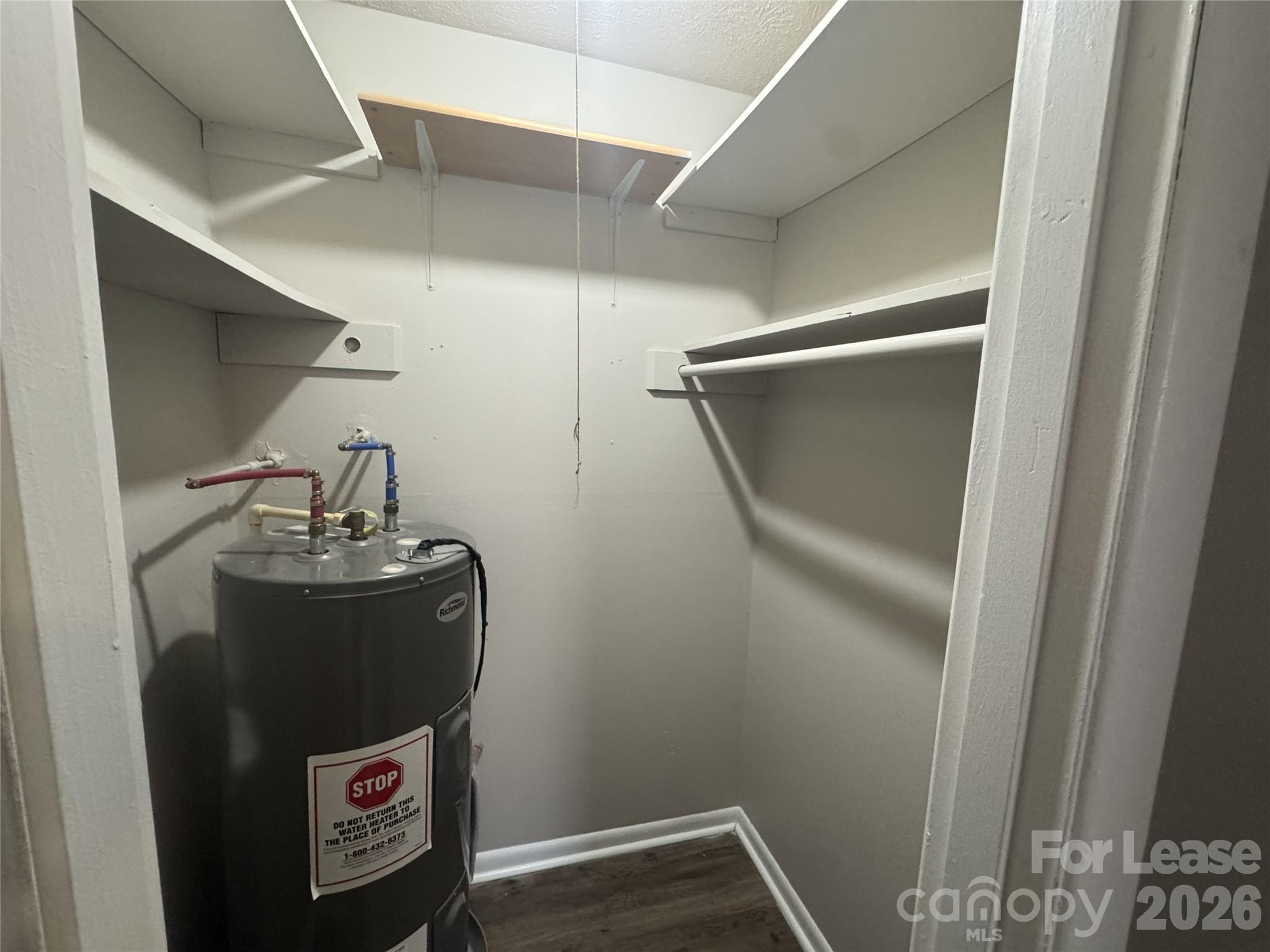 337 Laurel Street Hudson, NC 28638 - Photo 7 of 7 a room with water heater and racks