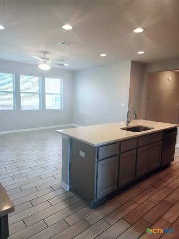 a bathroom with a sink a vanity and a bathtub