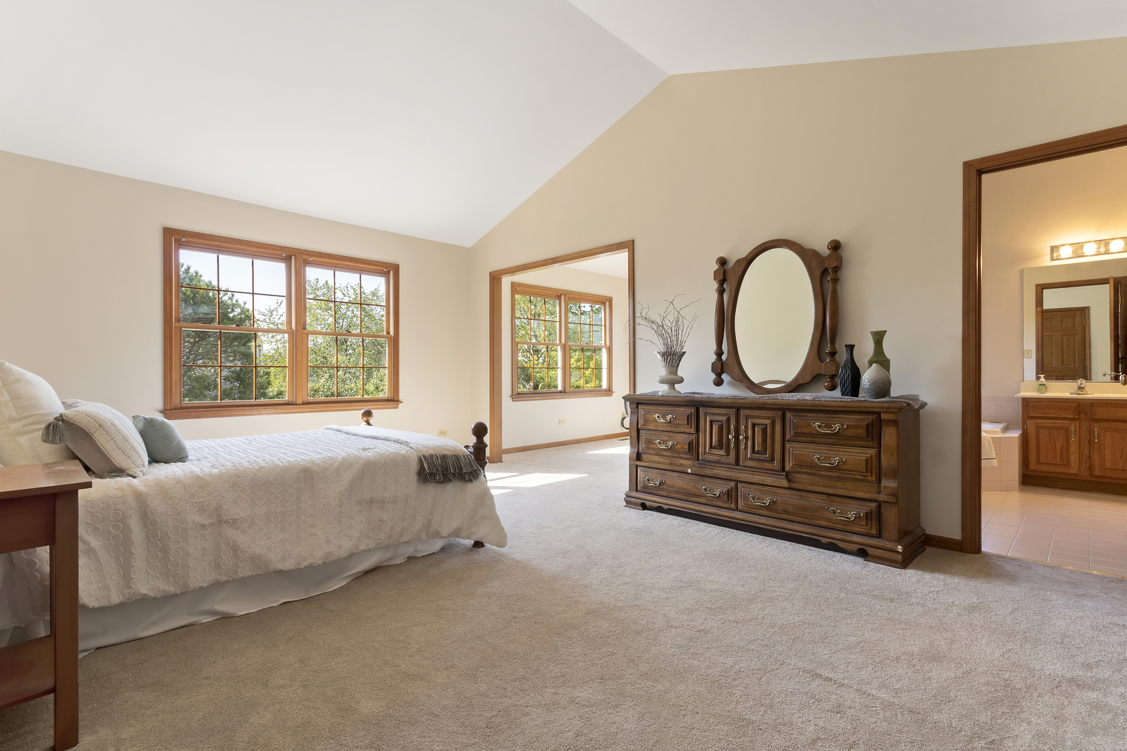 17929 West Pond Ridge Circle Gurnee, IL 60031 - Photo 15 of 28 a bed room with a bed a dresser and a window