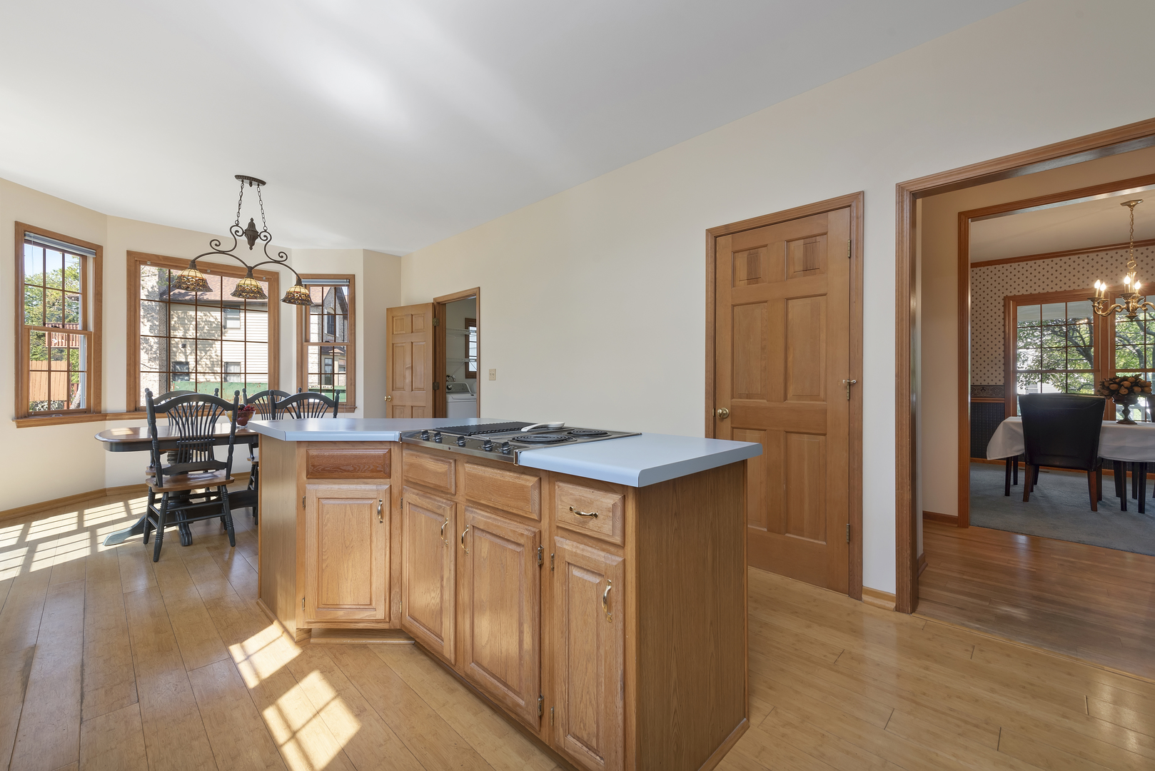 17929 West Pond Ridge Circle Gurnee, IL 60031 - Photo 7 of 28 a kitchen with stainless steel appliances granite countertop a stove top oven a dining table and chairs with wooden floor