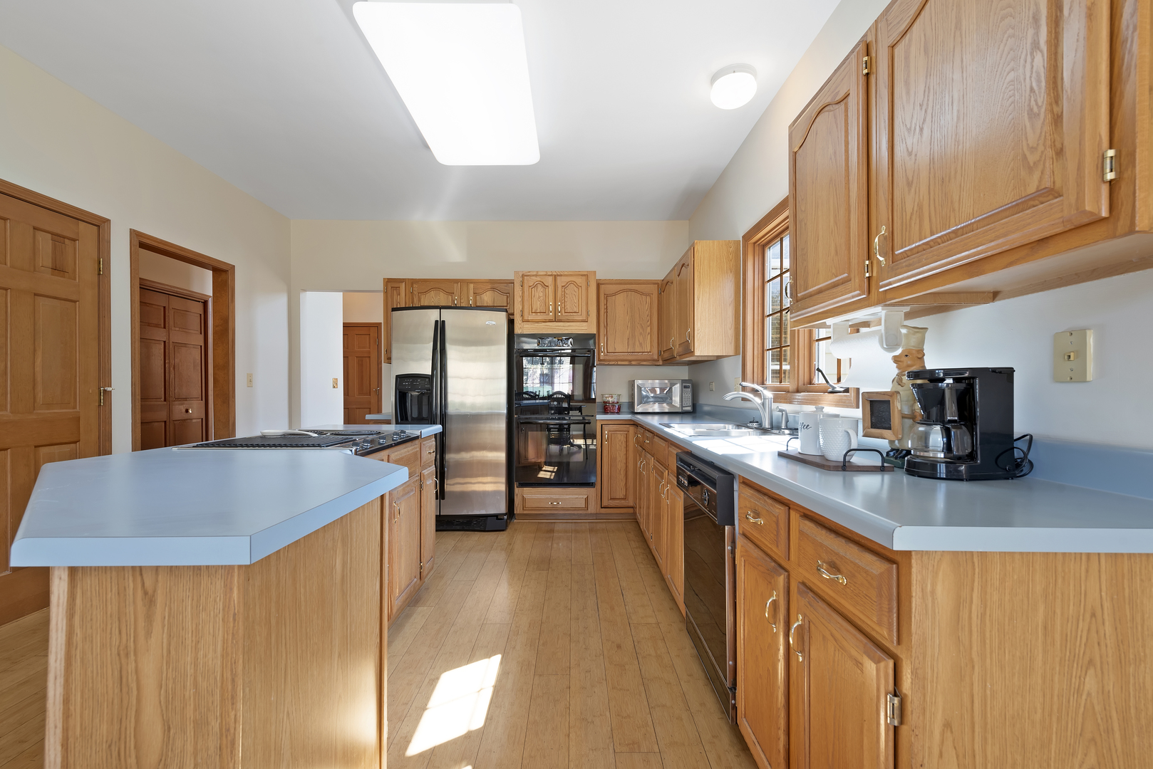 17929 West Pond Ridge Circle Gurnee, IL 60031 - Photo 8 of 28 a kitchen with stainless steel appliances granite countertop sink stove and refrigerator