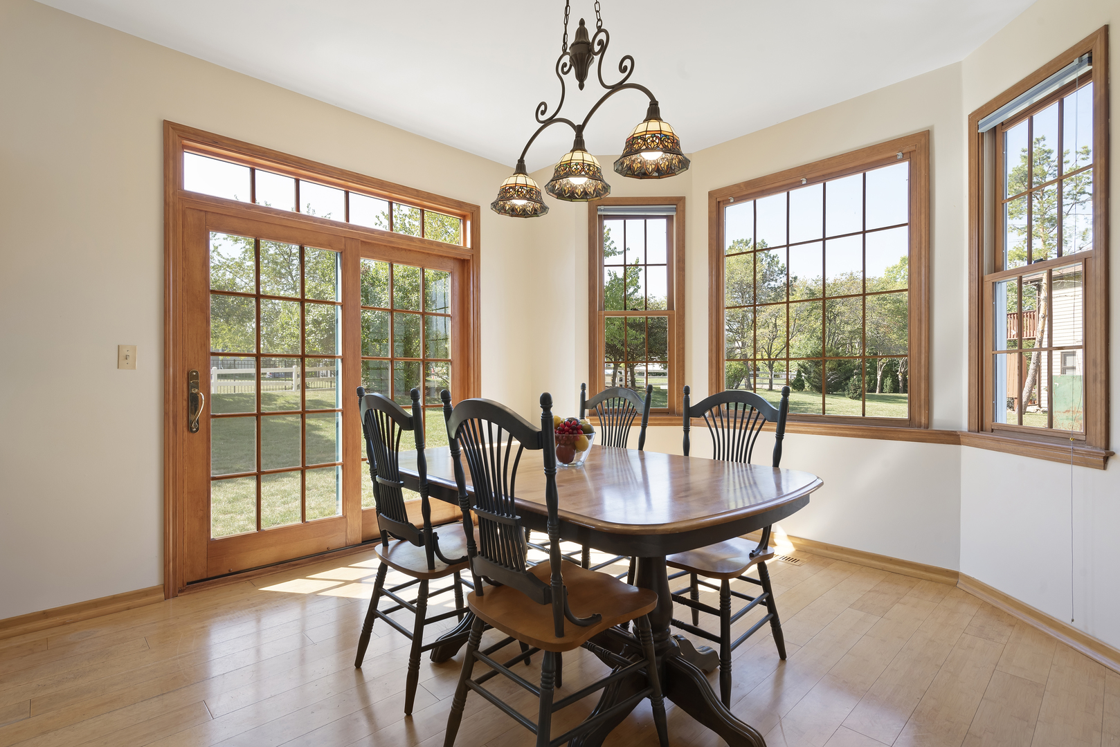 17929 West Pond Ridge Circle Gurnee, IL 60031 - Photo 9 of 28 a view of a dining room with furniture large windows and wooden floor