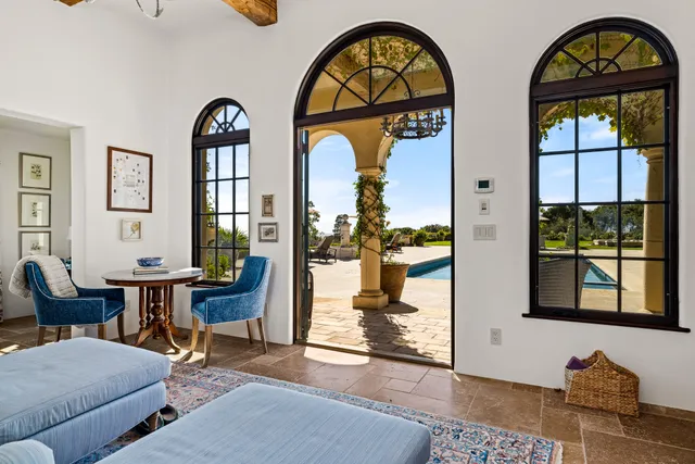 a view of hall way with furniture