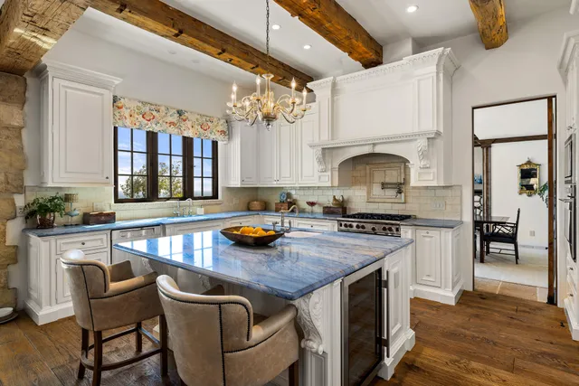 a kitchen with a stove a sink and a refrigerator
