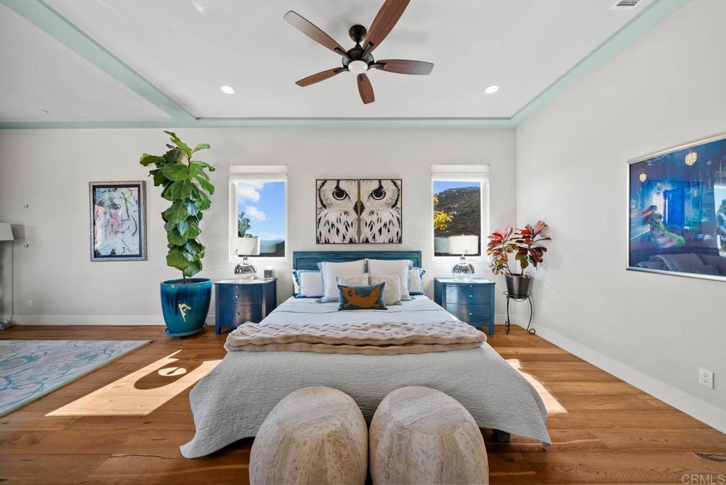 13495 Del Poniente Road Poway, CA 92064 - Photo 24 of 60 a bedroom with a bed and wooden floor