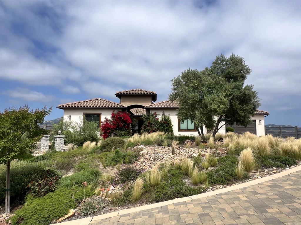 13495 Del Poniente Road Poway, CA 92064 - Photo 3 of 60 a view of a house with a yard and sitting area