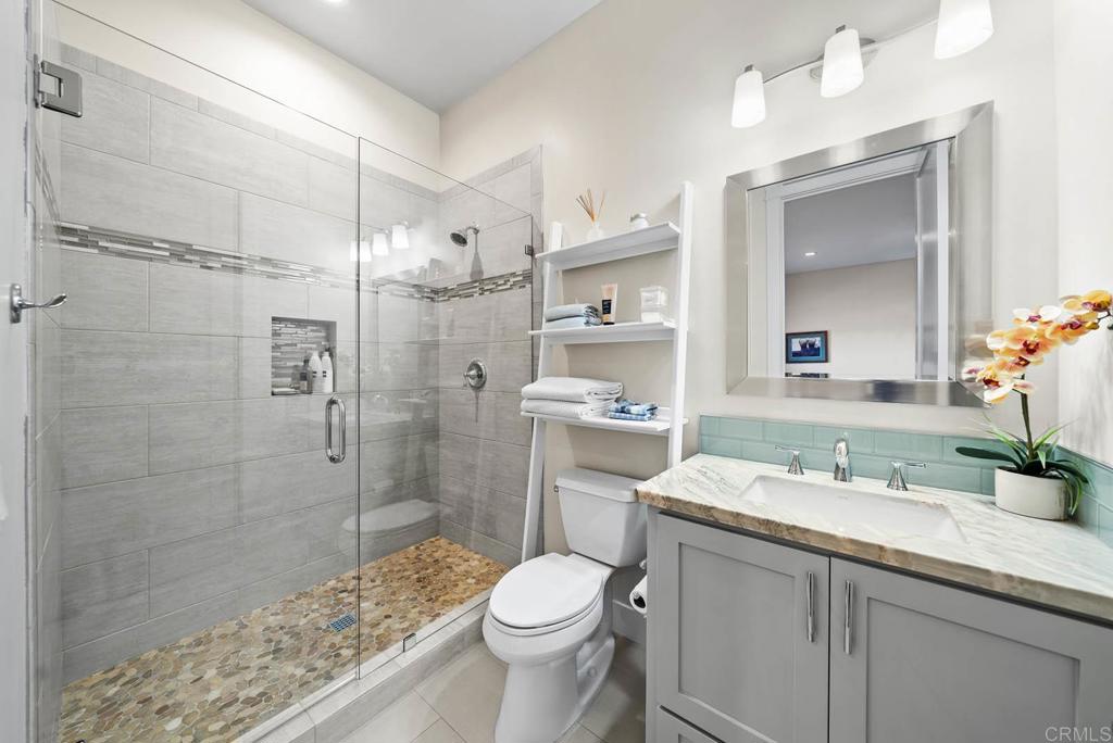 13495 Del Poniente Road Poway, CA 92064 - Photo 33 of 60 a bathroom with a sink toilet and shower