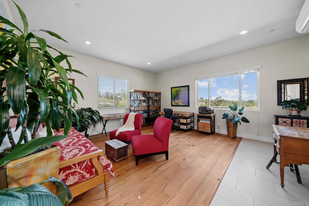 13495 Del Poniente Road Poway, CA 92064 - Photo 49 of 60 a living room with furniture and a potted plant